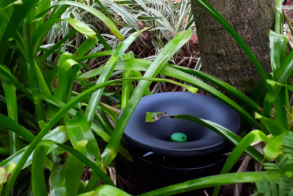 In2Care mosquito station in bushes